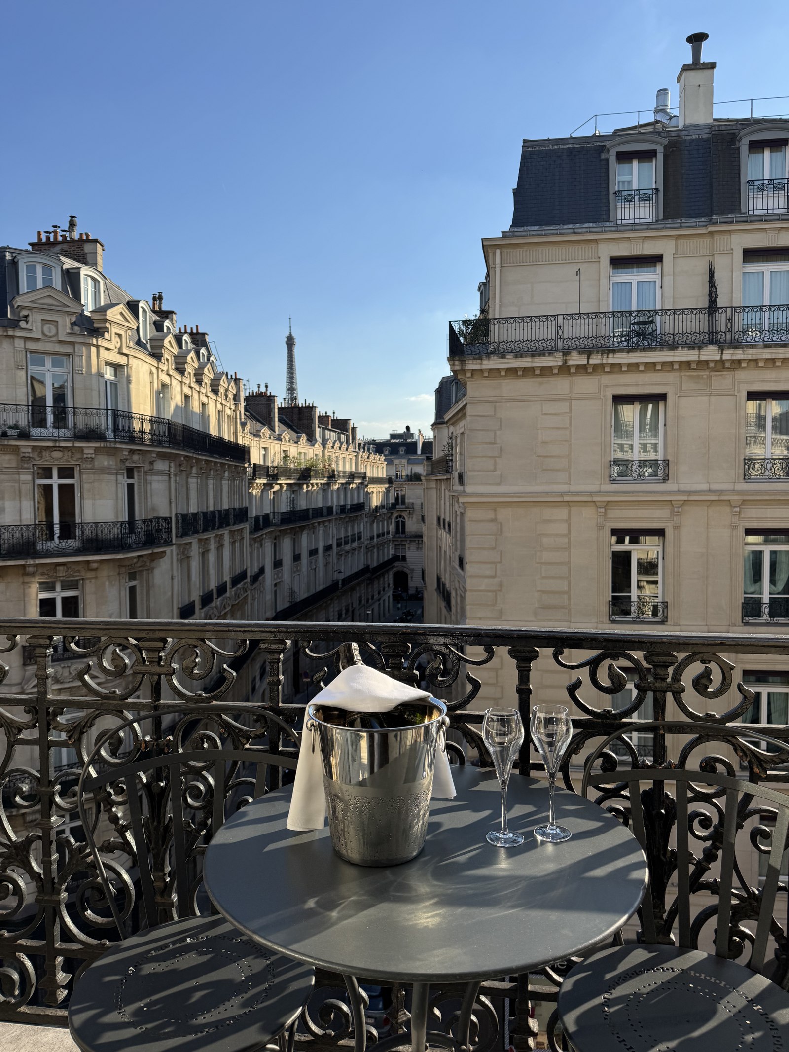 Champagne chilling on a Paris balcony at golden hour